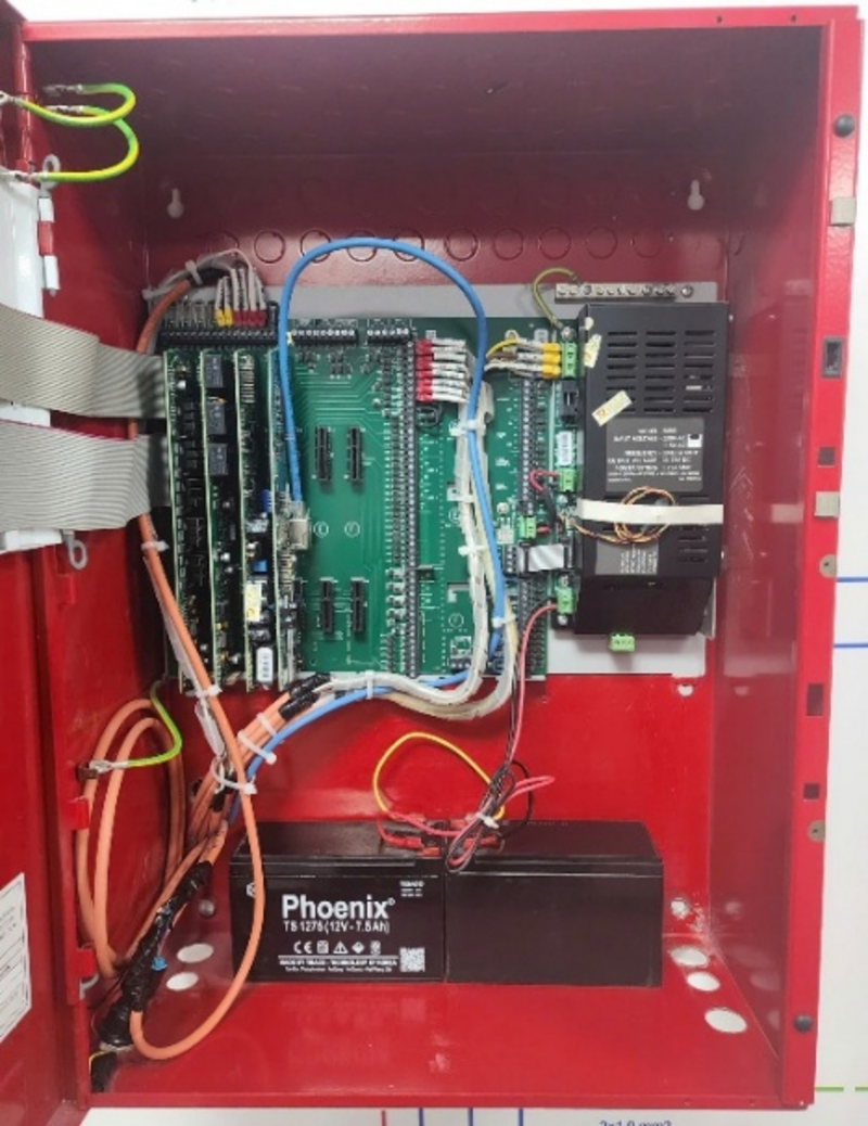 A red box with wires and circuit boards
AI-generated content may be incorrect.